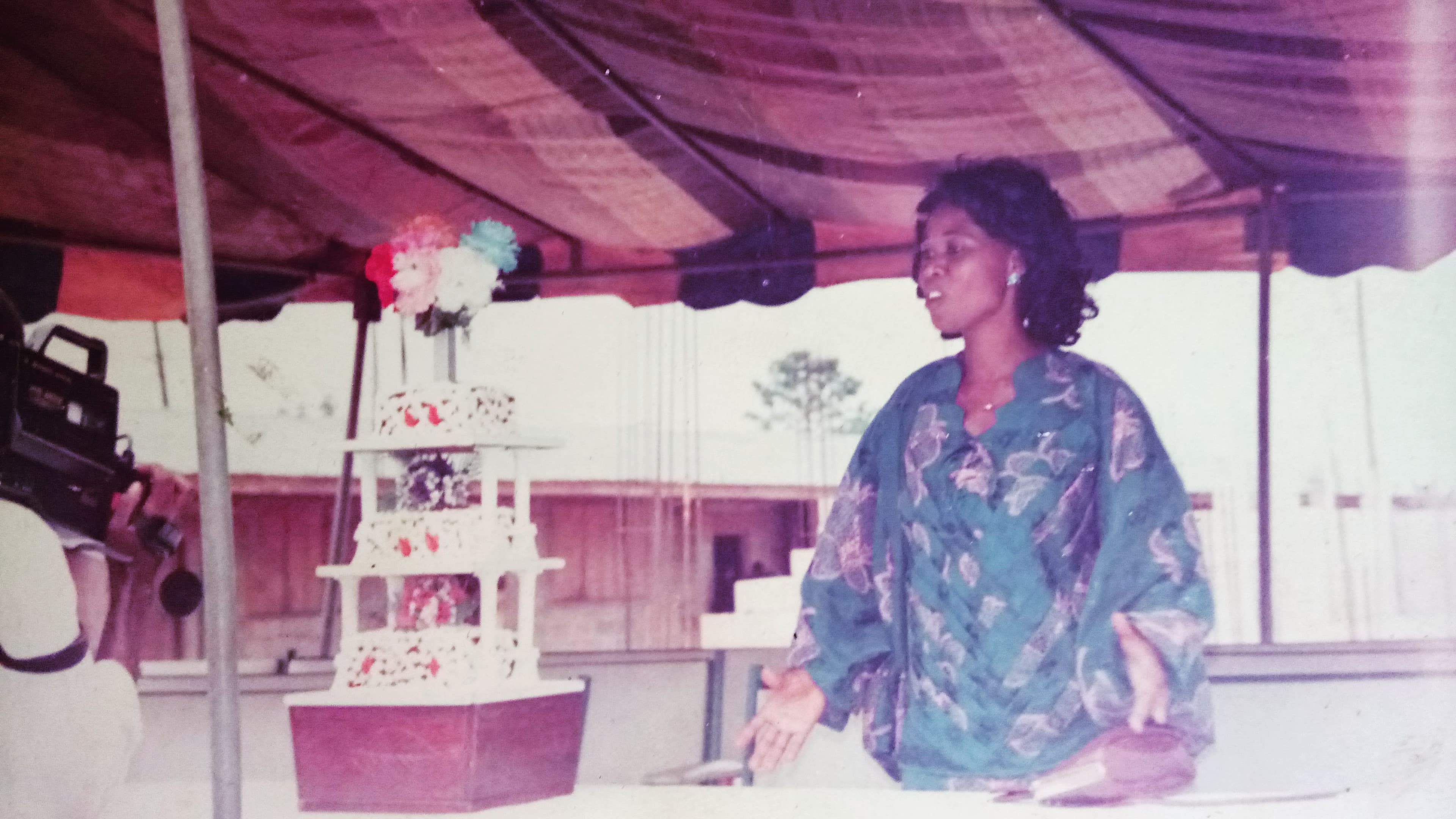 Lady Evette Anyanwu speaking at a catering event